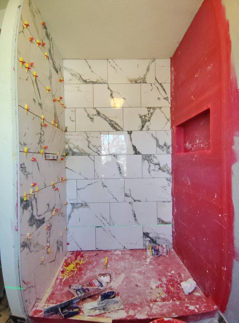 Marble Tile Going Up — Chess Remodels project