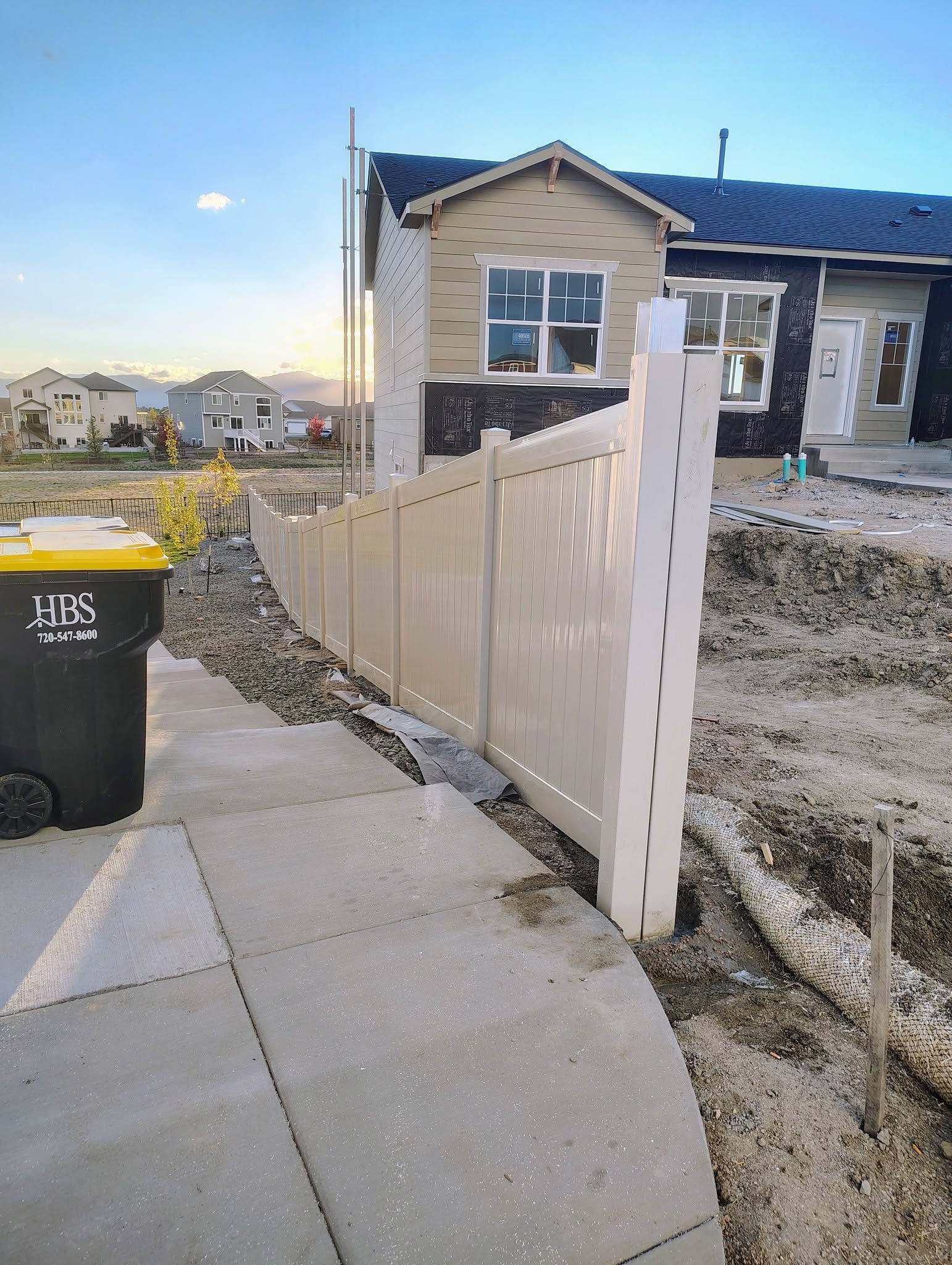 Vinyl Fence at Sunset — Chess Remodels project